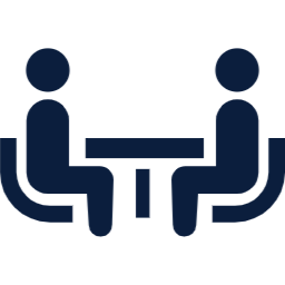 机を挟んで対面する二人のアイコン